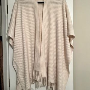 Cream fringed cape.